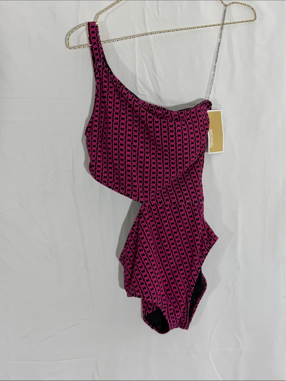 Michael Kors one shoulder, cut out chain, pink, and black one piece
